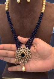 Turning multilayered purple beads short necklace with diamond look pendant